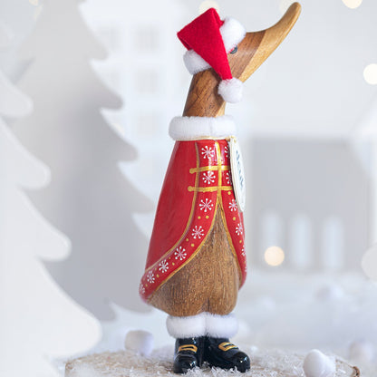 Decorative figurine of a duck wearing a red cape and Santa hat on a white background