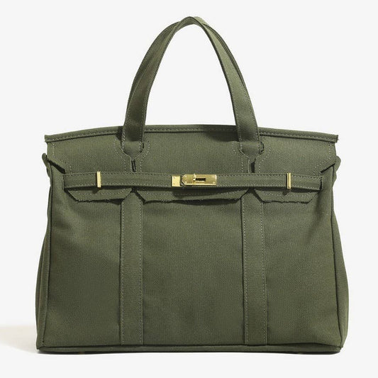 Green handbag with gold accents on a white background