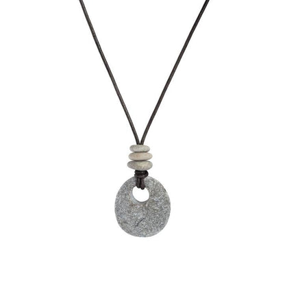 Necklace with a textured stone pendant and stone beads on a white background