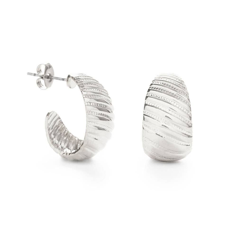 Silver hoop earrings on a white background
