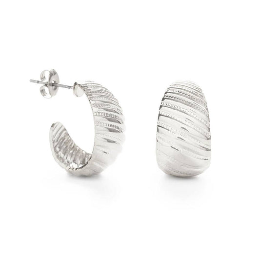 Silver hoop earrings on a white background