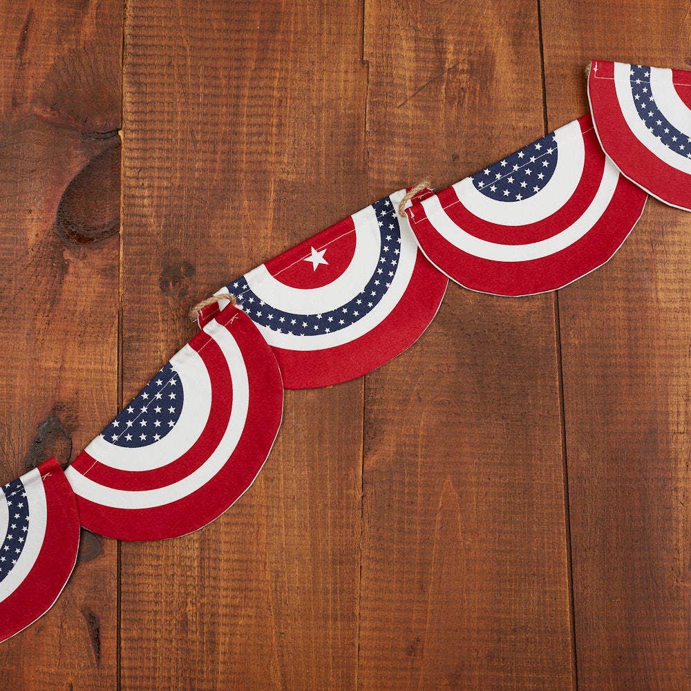 American flag-themed fabric garland on a wooden surface