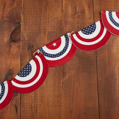 American flag-themed fabric garland on a wooden surface