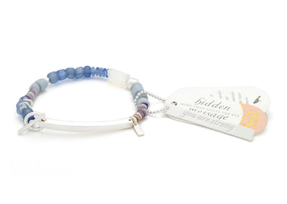 Multicolored beaded bracelet with a tag on a white background