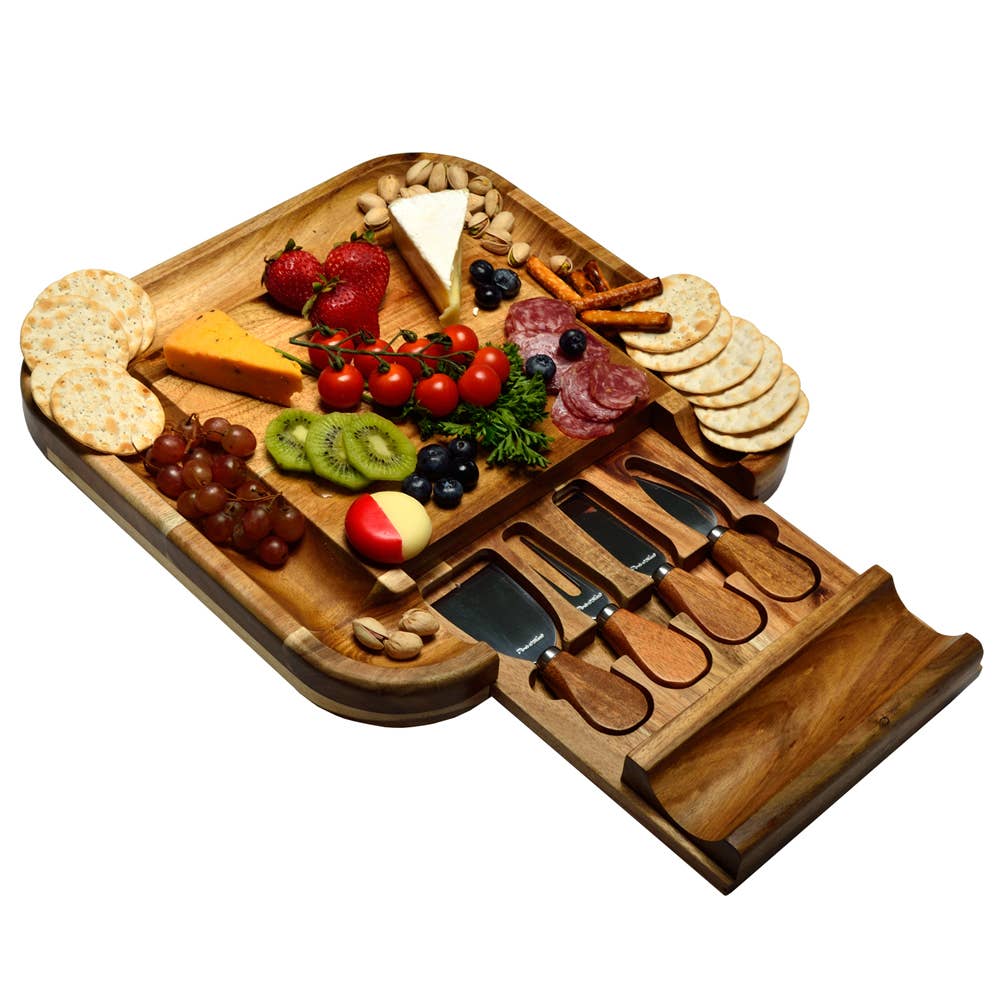 Wooden charcuterie board with assorted foods and utensils on a white background. All images associated with this listing show the same piece from various angles and with different styling props.