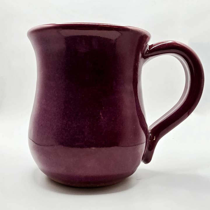 Purple mug on a white background