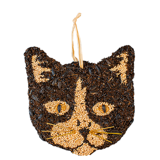 Cat-shaped seed ornament with black and gold design on a white background