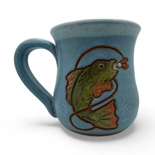 Ceramic mug with fish and lure design on a light blue background