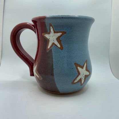 Ceramic mug with star design on a white background