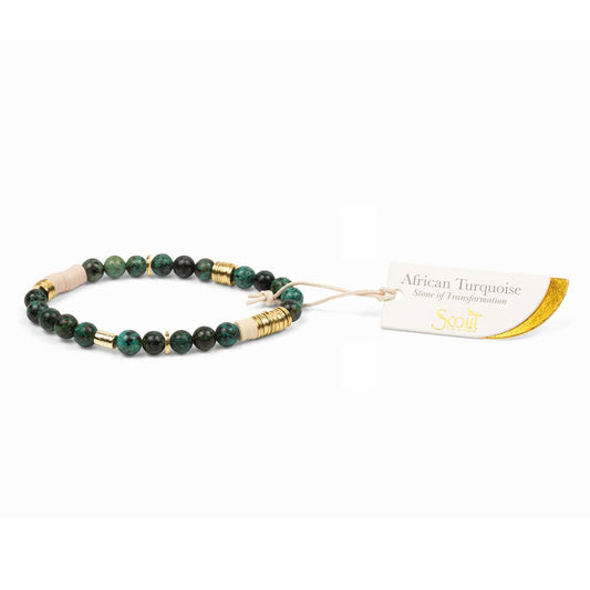 Beaded bracelet with gold accents on a white background, featuring a tag labeled 'African Turquoise'.