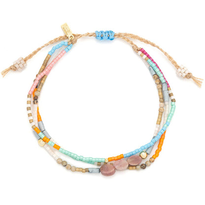 Colorful beaded bracelet with multiple strands on a white background.
