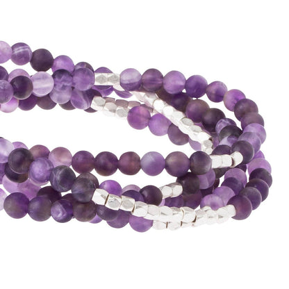 Convertible beaded amethyst necklace/wrap bracelet with silver accents on a white background