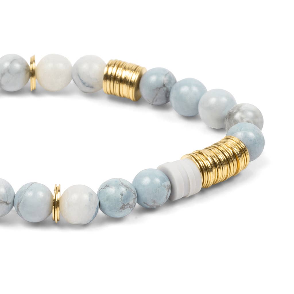Beaded bracelet with gold accents on a white background