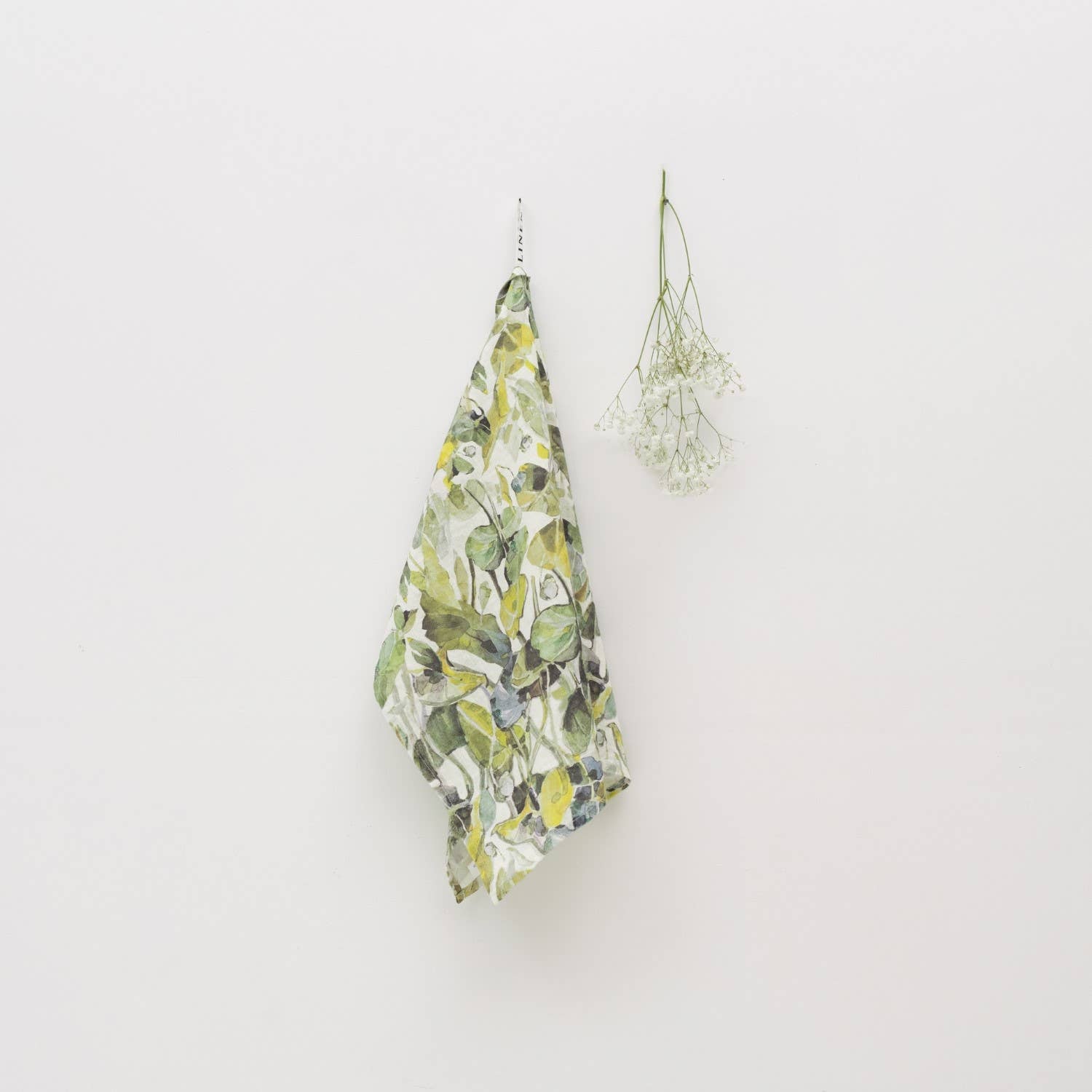 Floral-patterned fabric hanging on a white wall