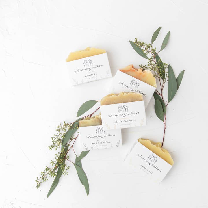 Bar soaps with eucalyptus leaves on a white background