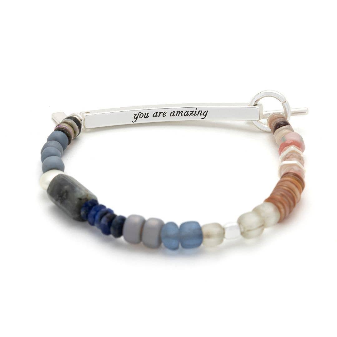Multicolored beaded bracelet with a silver bar featuring 'you are amazing' on a white background