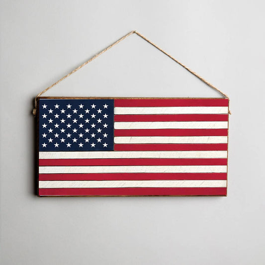 Wooden sign with American flag design hanging against a light gray background