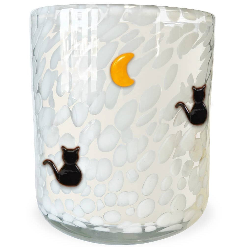 Glass candle with textured surface, black cats, and a yellow moon on a white background
