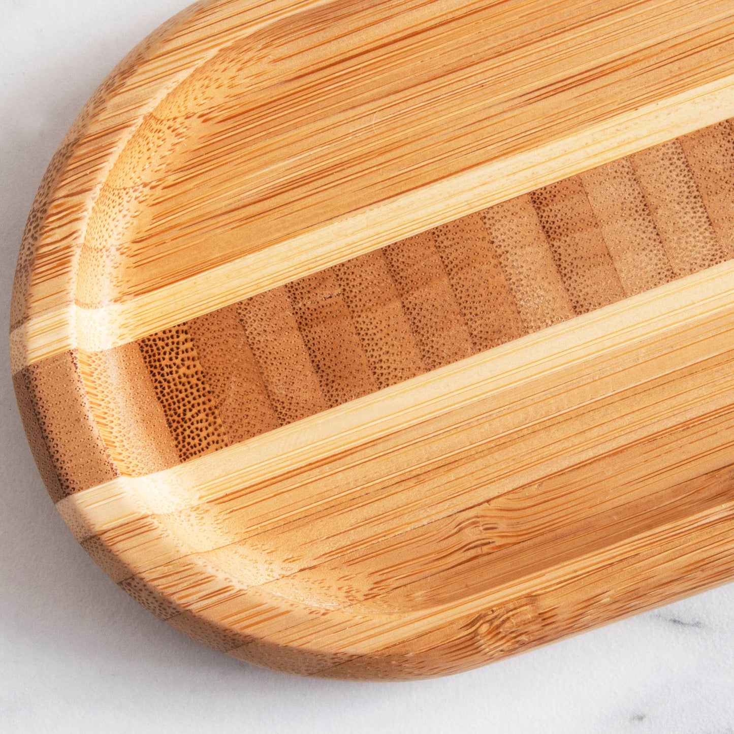 Close-up of a wooden tray on a white surface