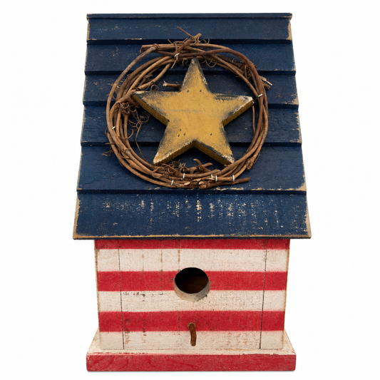 Birdhouse with blue roof with yellow star and striped red and white front on a white background.