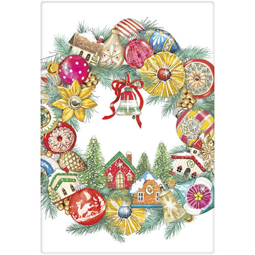 Decorative Christmas-themed tea towel with colorful ornaments and small houses.
