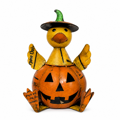 Halloween-themed duck figurine with pumpkin body and witch hat on a white background