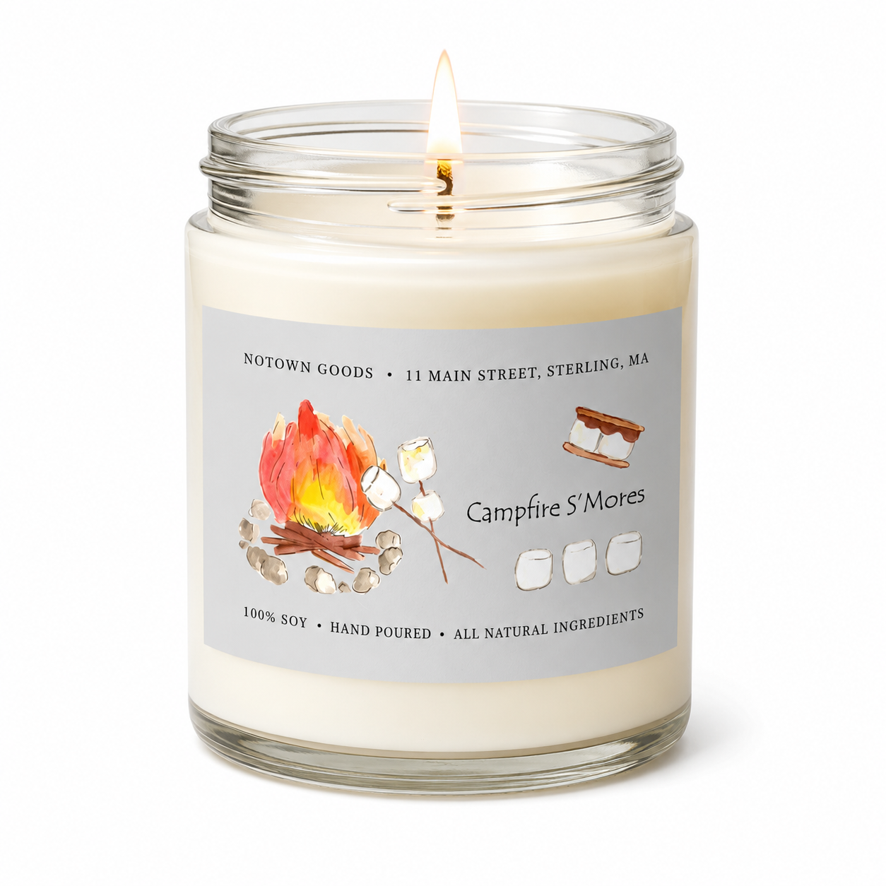 Clear jar candle with white wax and a decorative label on a white background.