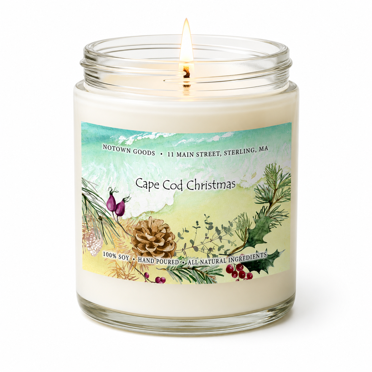 Clear jar candle with white wax and a decorative label on a white background.