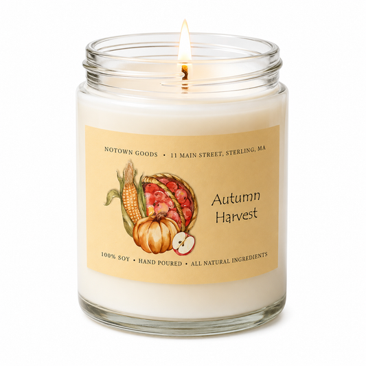 Clear jar candle with white wax and a decorative label on a white background.