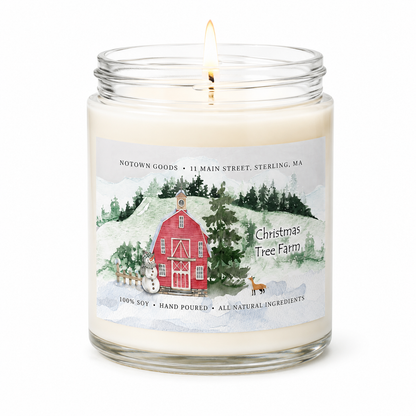 Clear jar candle with white wax and a decorative label on a white background.