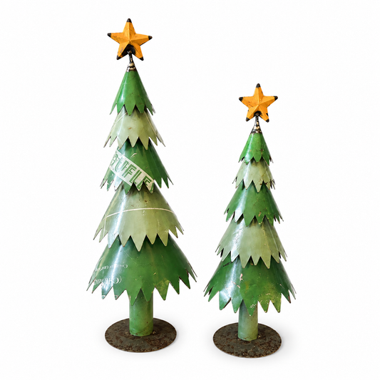 Two green metal Christmas trees with star toppers on a white background