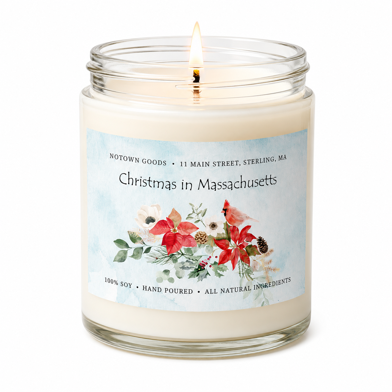 Clear jar candle with white wax and a decorative label on a white background.