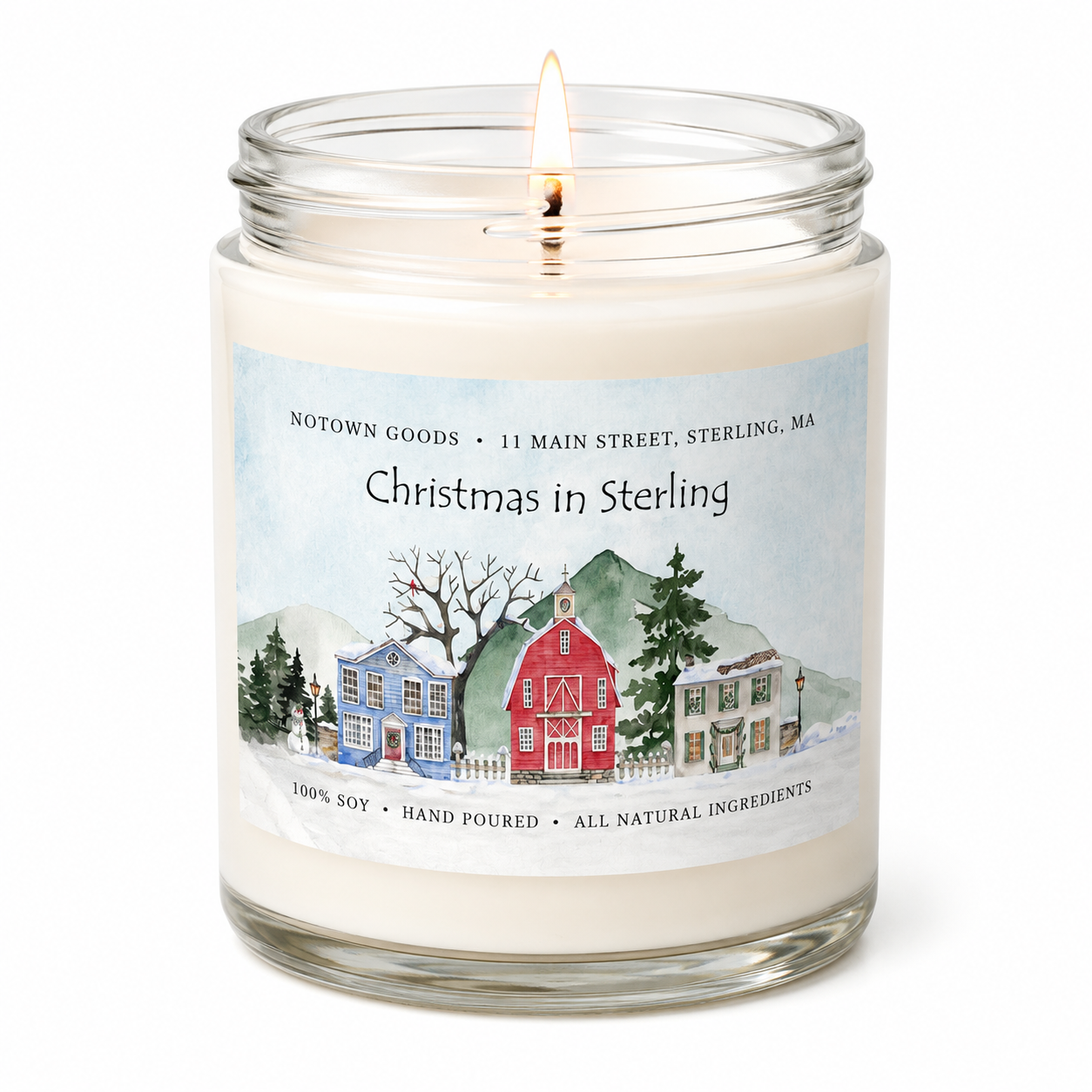 Clear jar candle with white wax and a decorative label on a white background.