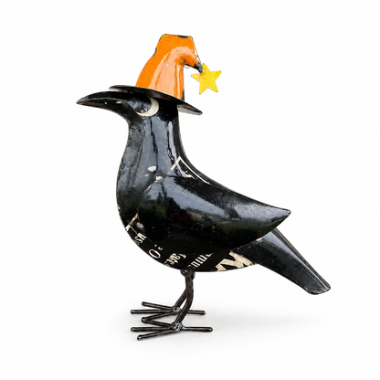 Black bird figurine with an orange hat and yellow star on a white background