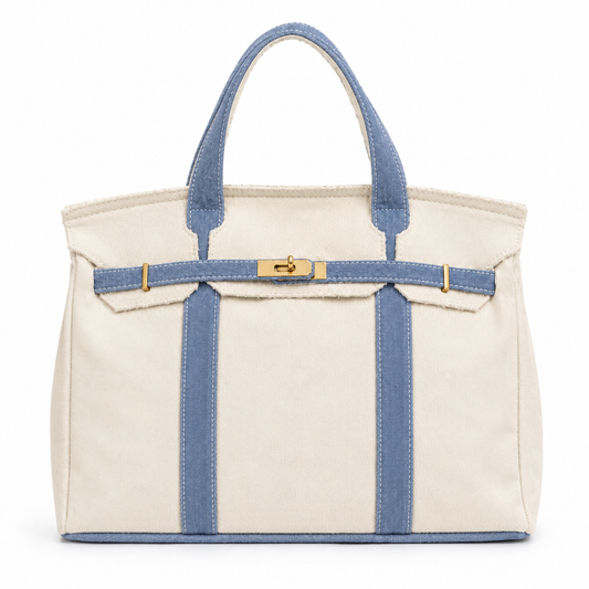 White tote bag with blue straps and trim on a white background