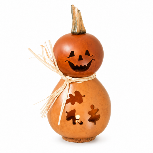 A decorative gourd lantern shaped like a jack-o'-lantern with a carved face, small leaf cutouts, a straw bow, and a short stem, shown on a plain white background.