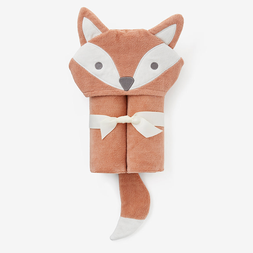 Fox-shaped towel with a white bow on a light gray background