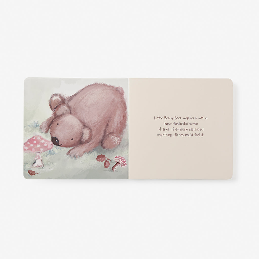 Illustrated book page with a bear and text on a white background