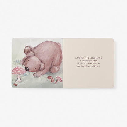 Illustrated book page with a bear and text on a white background