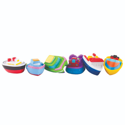Set of colorful toy boats on a white background