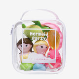 Clear plastic case with mermaid-themed toys and 'Mermaid Party' packaging on a white background