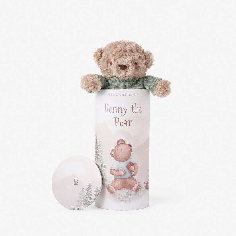Teddy bear in a cylindrical gift box with 'Benny the Bear' branding on a white background