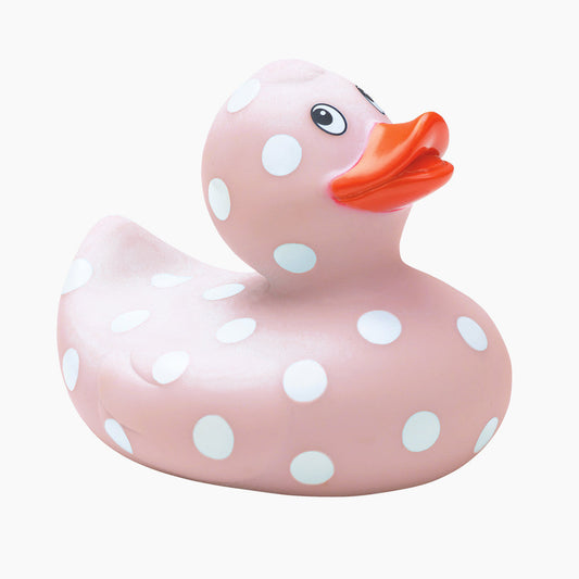 Pink rubber duck with white polka dots and an orange beak on a white background