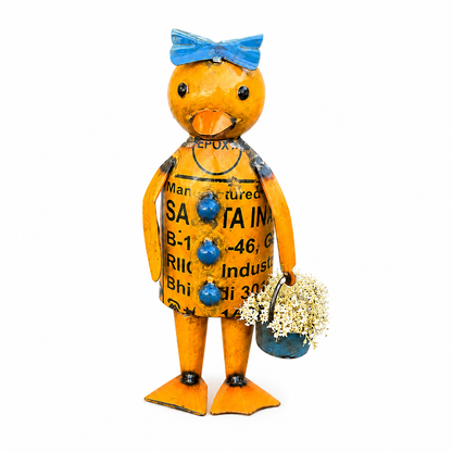 Decorative duck figurine with a blue bow and bucket filled with white flowers on a white background.
