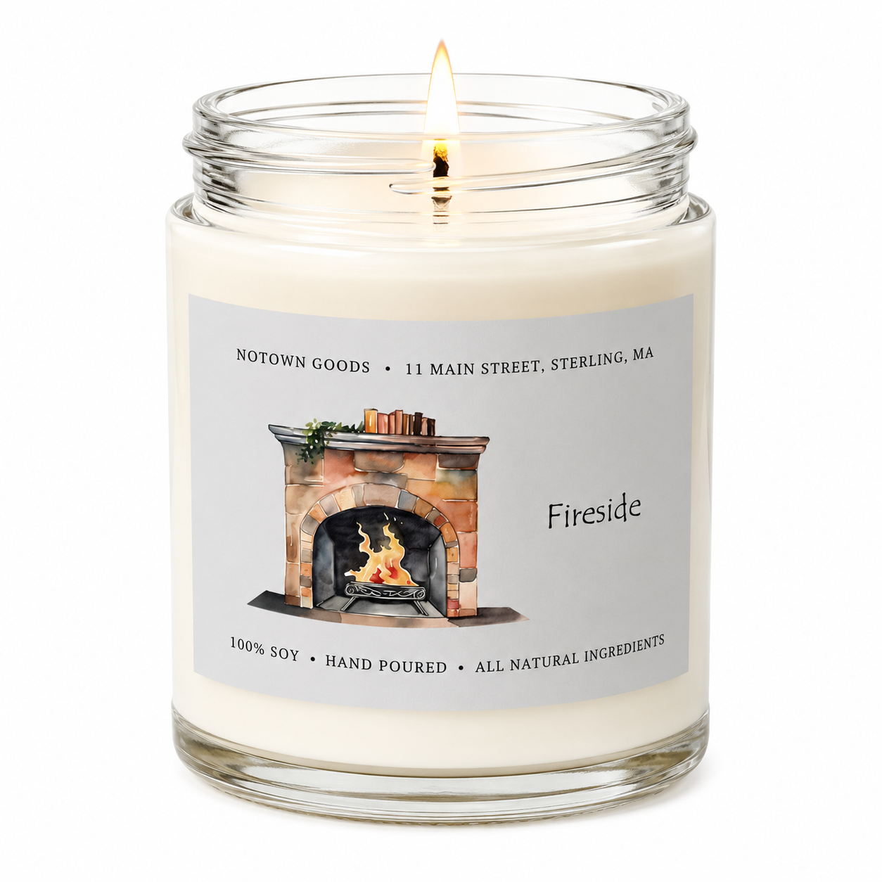 Clear jar candle with white wax and a decorative label on a white background.