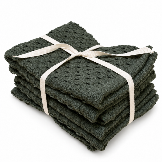 Set of 4 dark green placemats folded and bundled with a cotton twill ribbon.