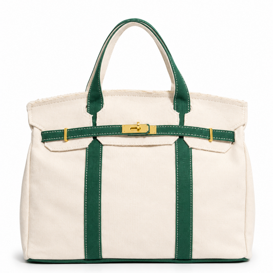 White tote bag with green straps on a white background