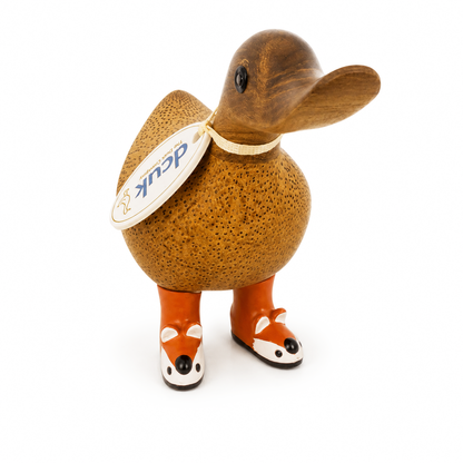 Wooden duck figurine with a tag on a white background