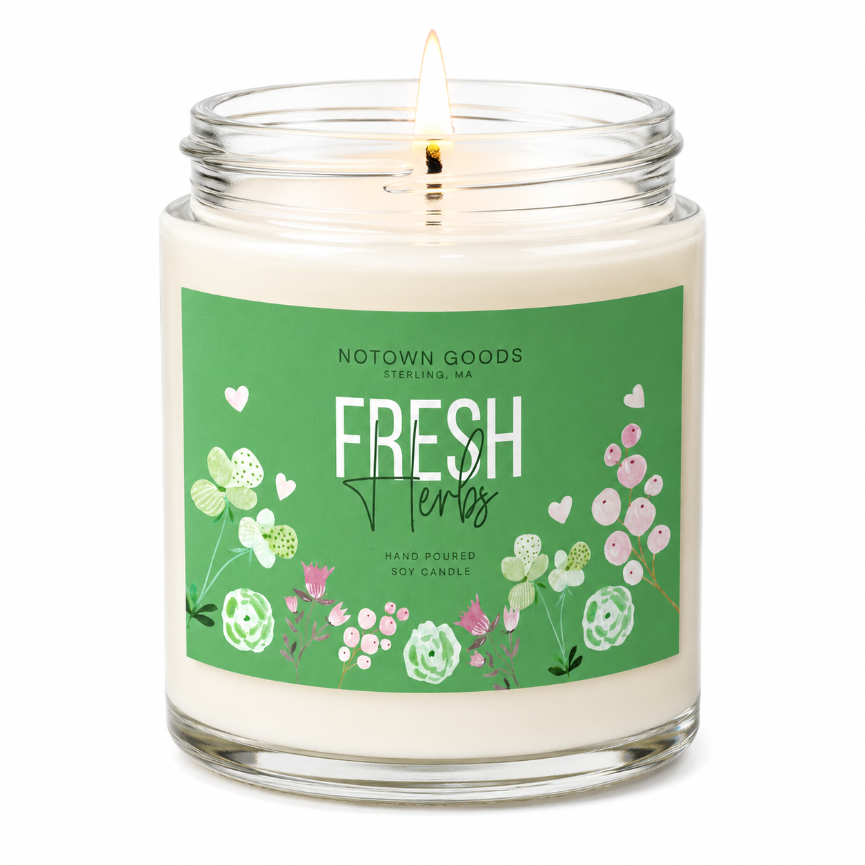 Clear jar candle with white wax and a decorative label on a white background.