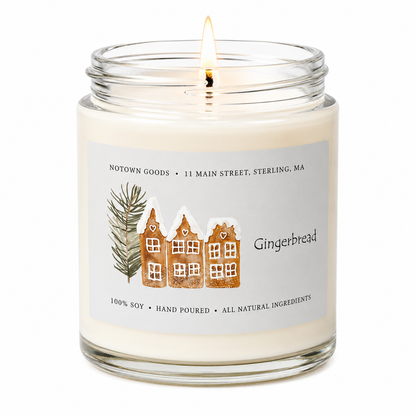 Clear jar candle with white wax and a decorative label on a white background.